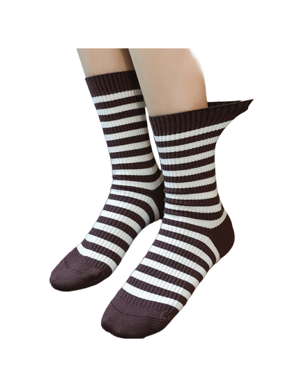 Coffee brown and ivory striped crew socks with the ribbed cuff stretched by hand