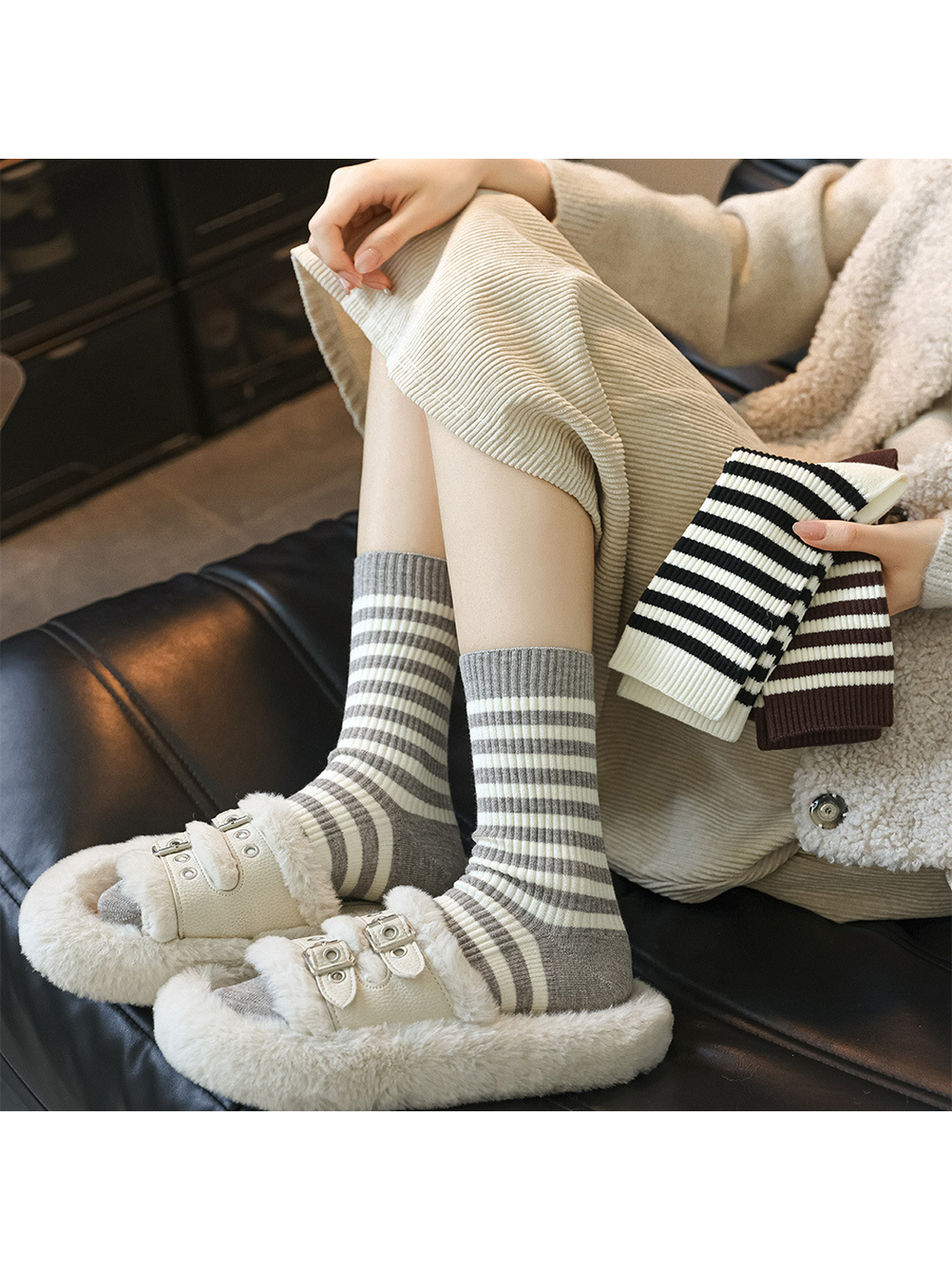 Light gray striped crew socks styled with plush slippers while other colors are held