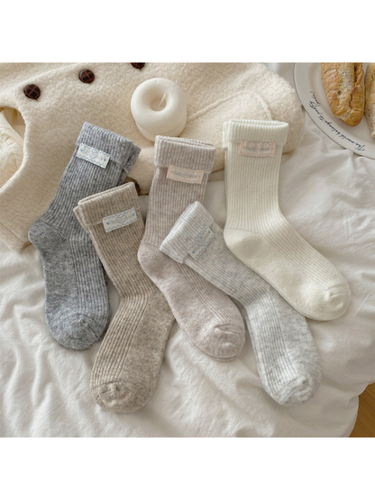 Five neutral ribbed crew sock styles displayed together