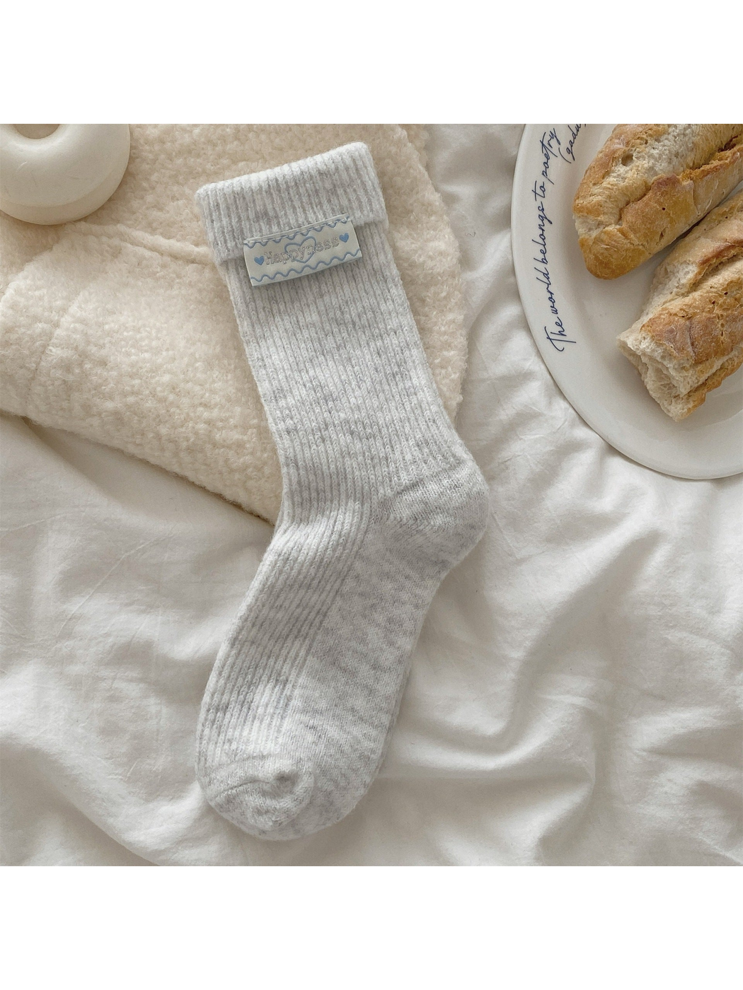 Light gray ribbed crew sock with fold-over cuff and heart label