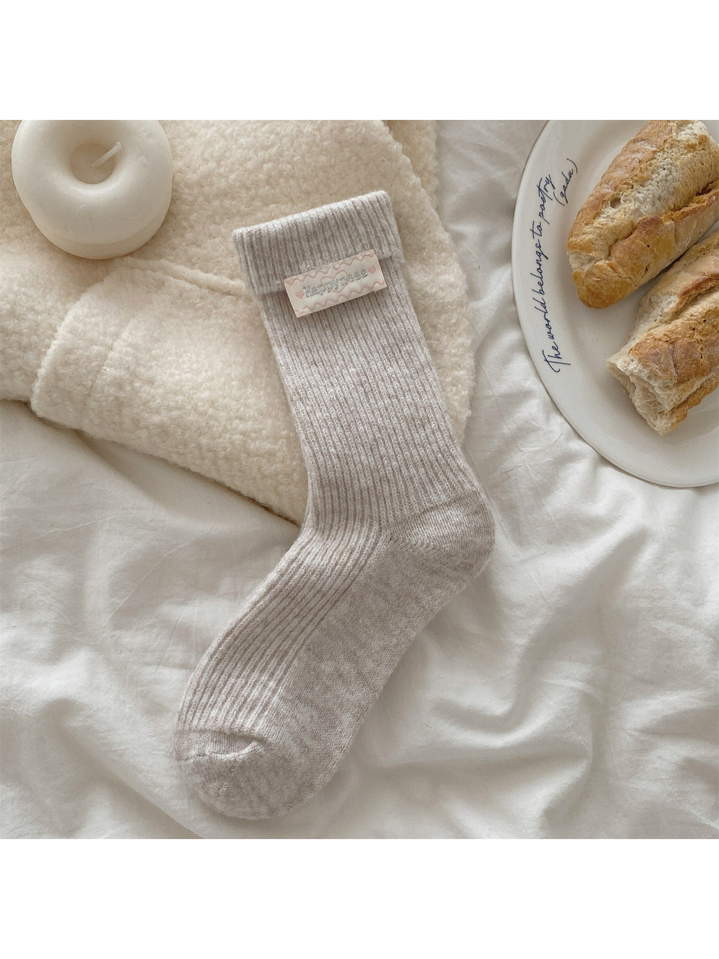 Beige ribbed crew sock with fold-over cuff and heart label