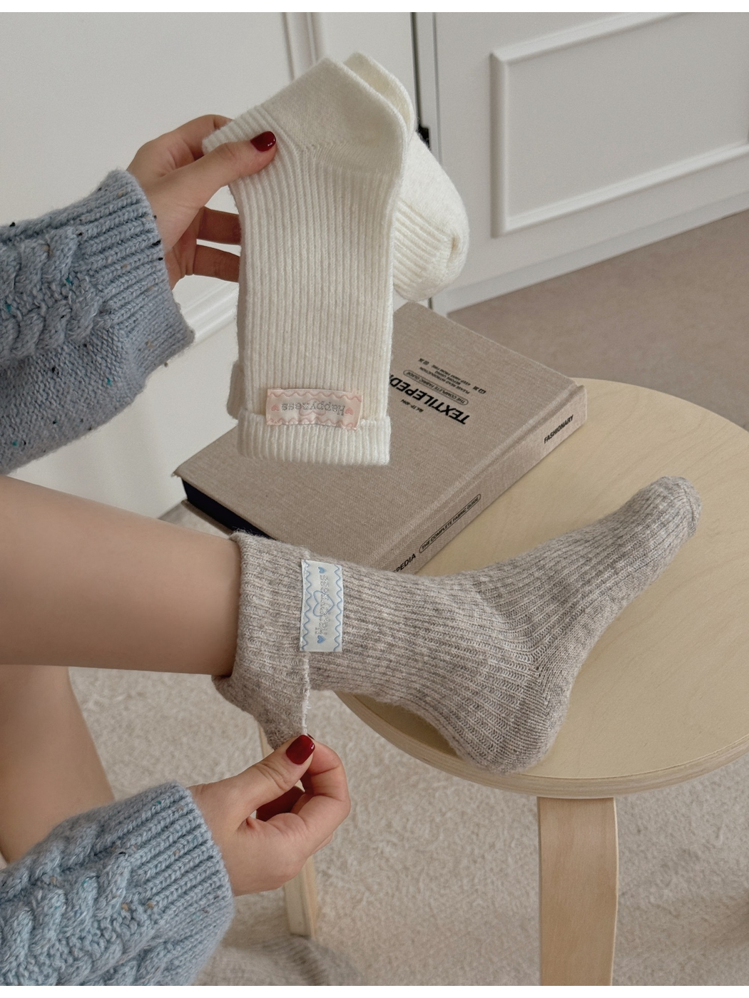 Neutral ribbed crew socks shown worn and held with a folded cuff