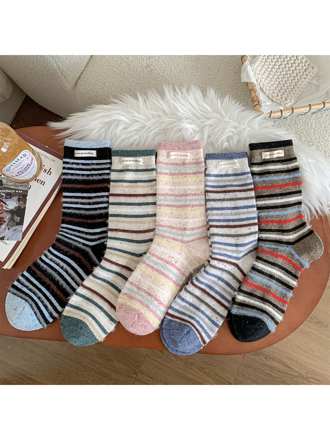 Five fuzzy striped crew sock colorways displayed together