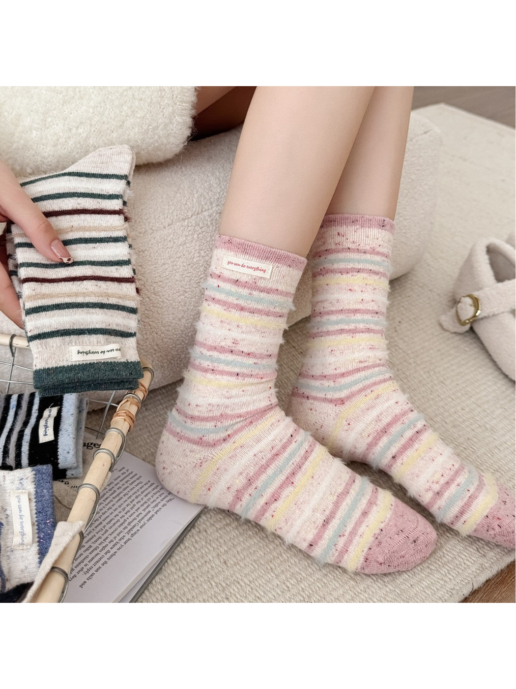Pink striped crew socks worn with cream slippers