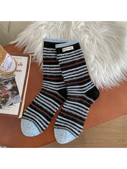 Black crew socks with blue, gray and brown stripes