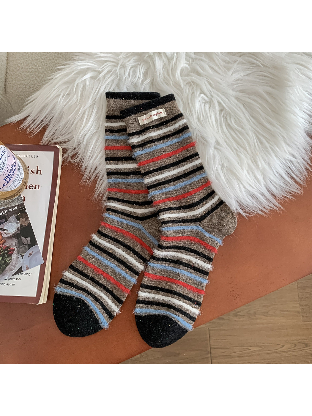 Brown crew socks with black, blue, red and cream stripes