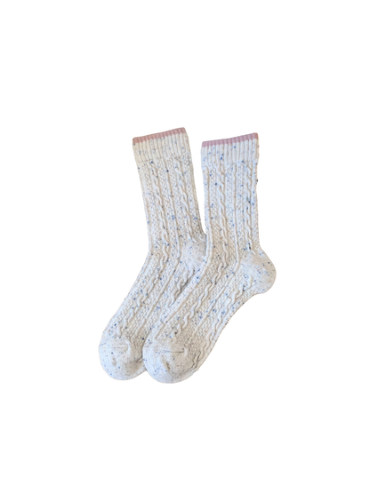 Ivory cable-textured crew socks with a pink cuff edge