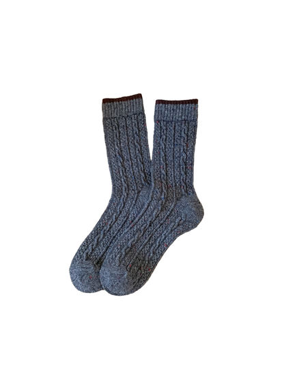 Dark gray cable-textured crew socks with a brown cuff edge