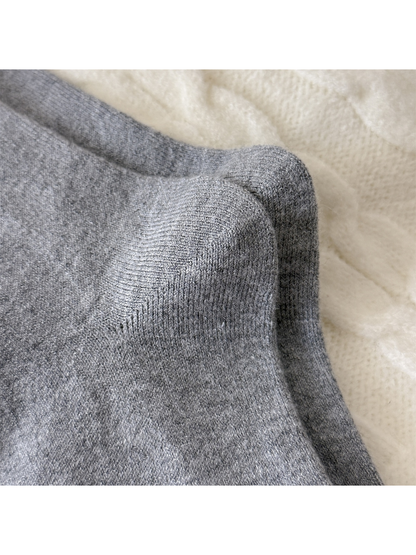 Close-up of the curved knit construction around the sock heels