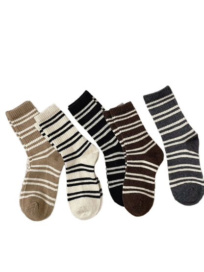 Five colors of irregular striped crew socks displayed on a white background