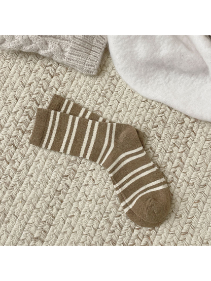 Khaki crew socks with irregular ivory stripes, full pair view