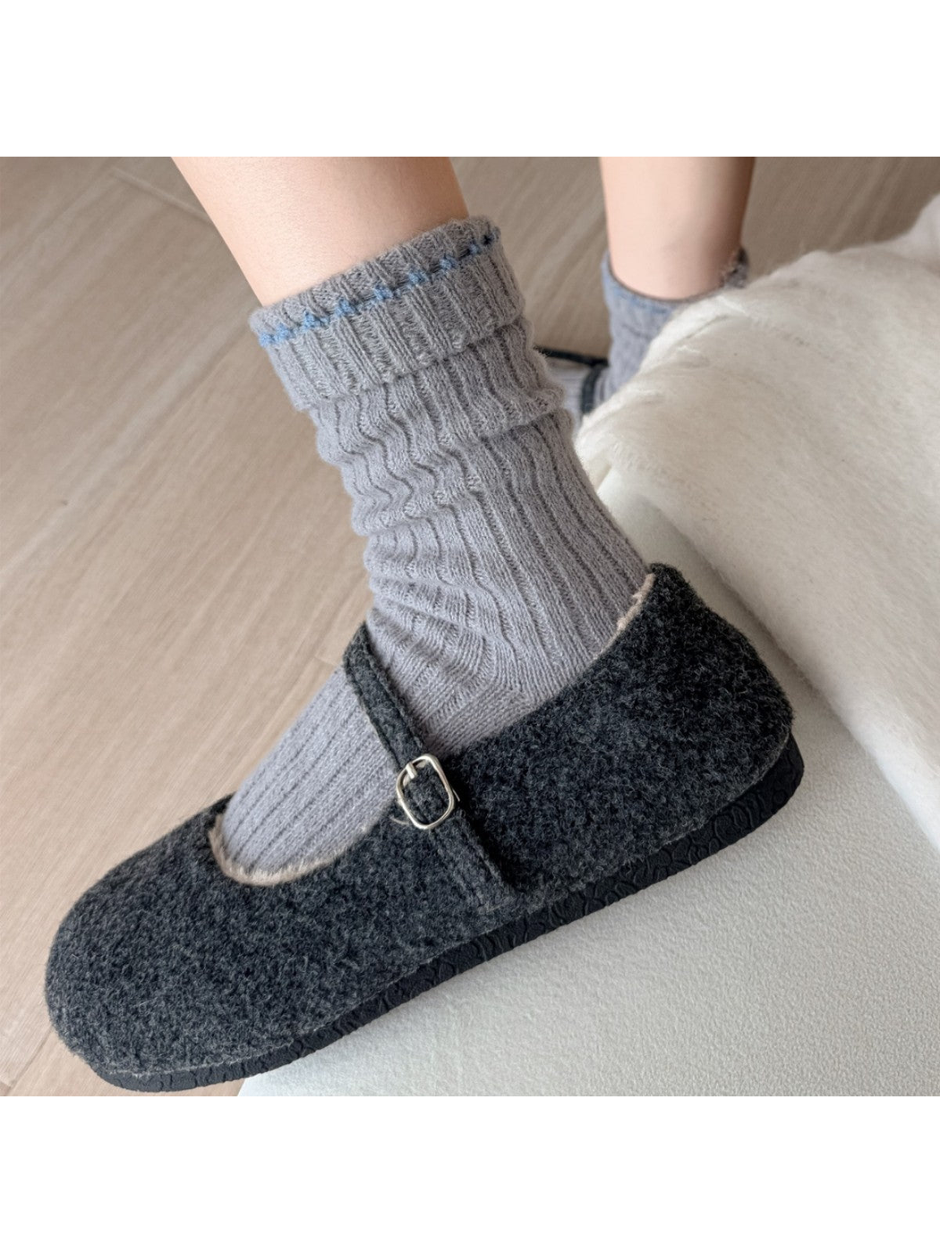 Gray ribbed crew socks worn with charcoal buckle shoes