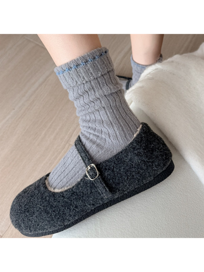 Gray ribbed crew socks worn with charcoal buckle shoes