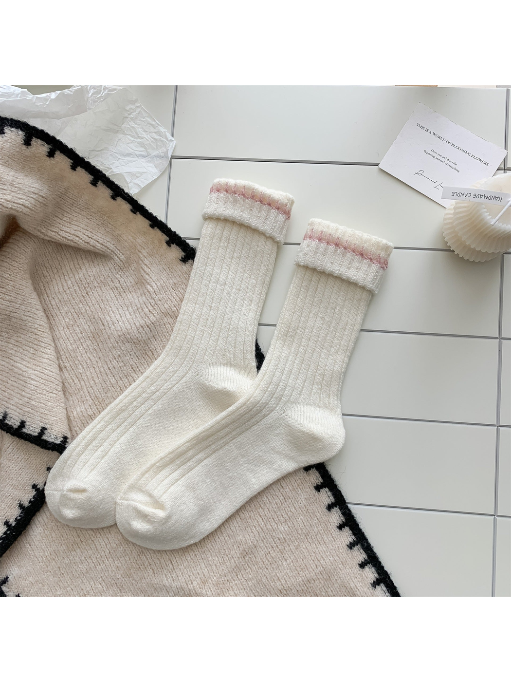 Ivory ribbed crew socks with pink contrast stitching, pair laid flat