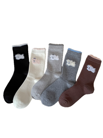 Five colors of fuzzy animal-motif crew socks displayed together