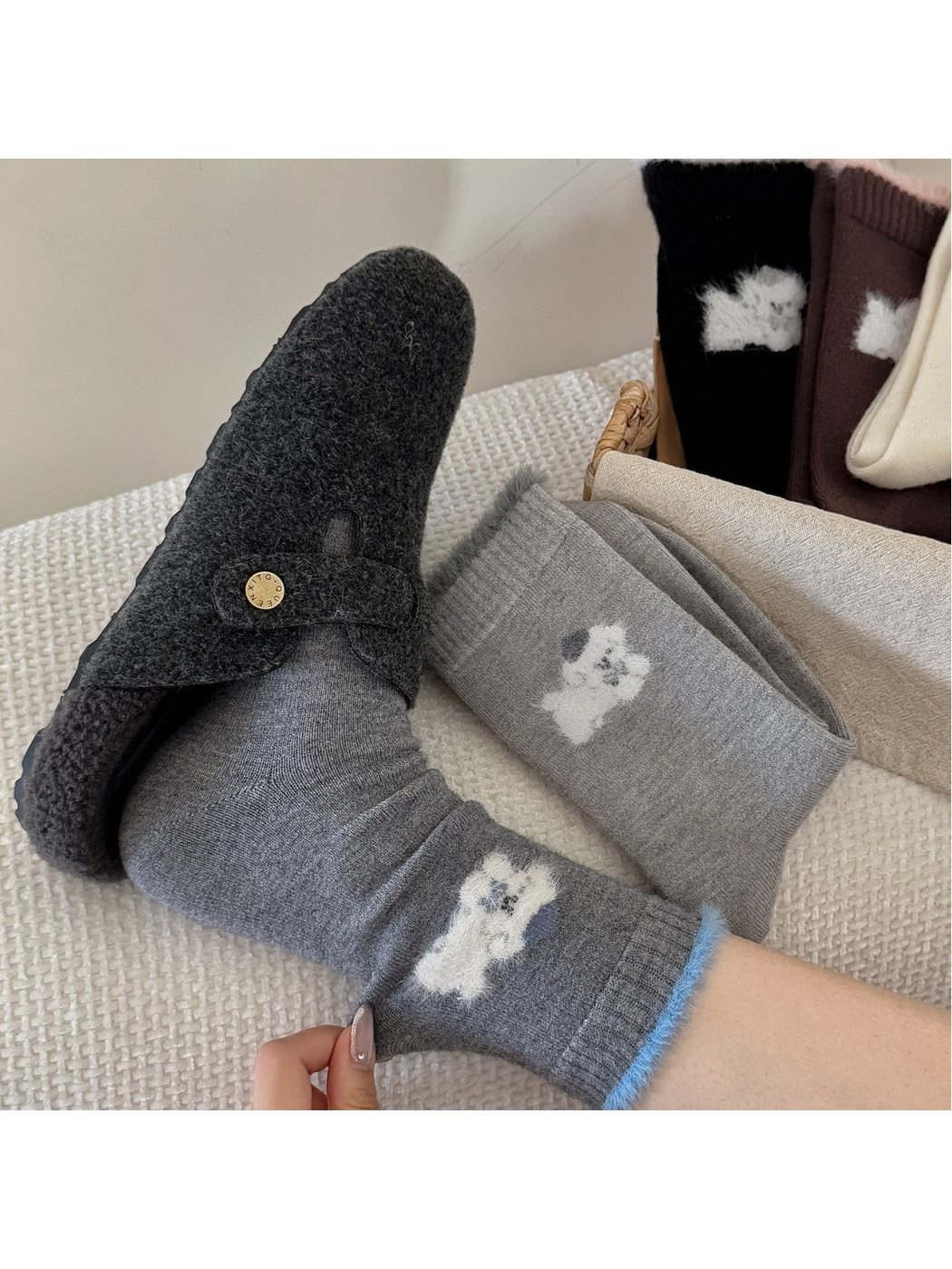 Gray animal-motif crew socks styled with a charcoal slipper