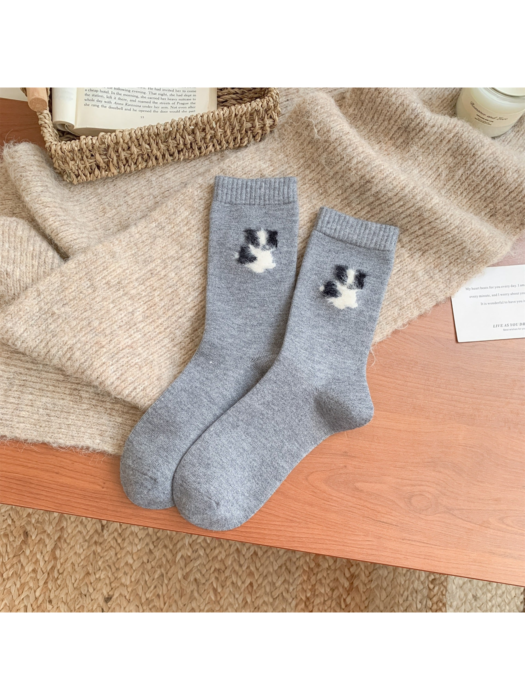 Heather gray crew socks with fuzzy black-and-white dog motifs