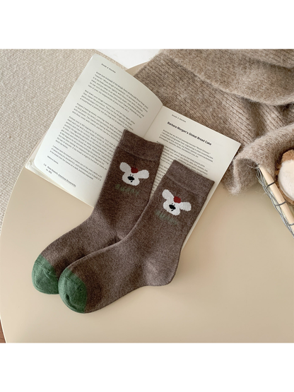 Dark brown puppy motif crew socks with green contrast toes