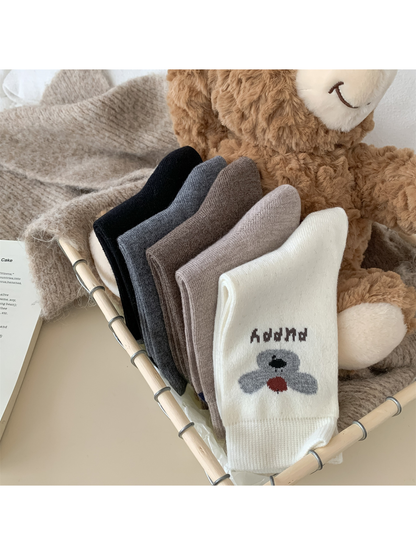 Folded puppy motif crew socks showing the reverse knit surfaces