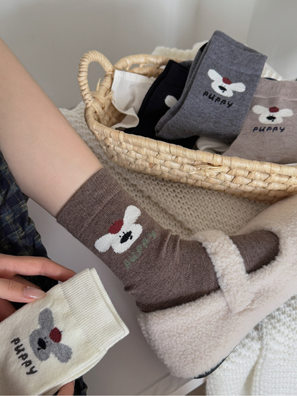 Dark brown puppy motif crew sock worn with a fleece-lined shoe