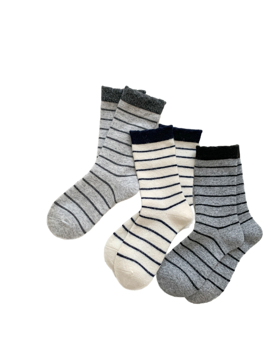 Light gray, ivory and medium gray striped socks on a white background