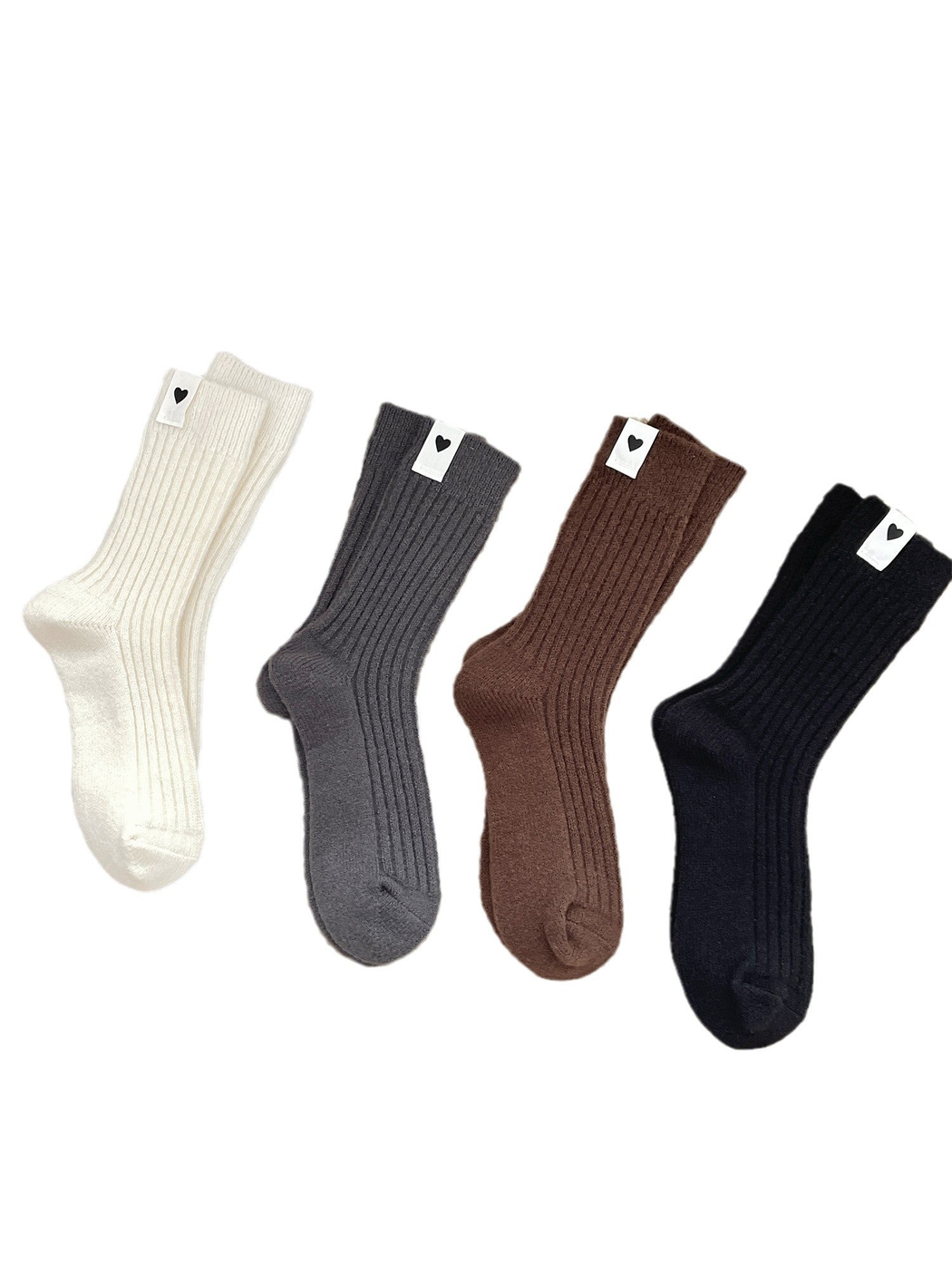 Cream, gray, brown and black ribbed crew socks with heart labels