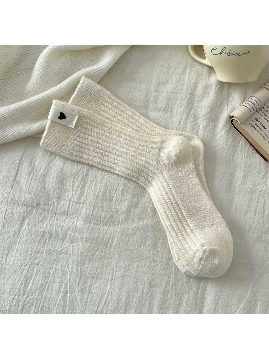 Cream ribbed crew socks with a heart label
