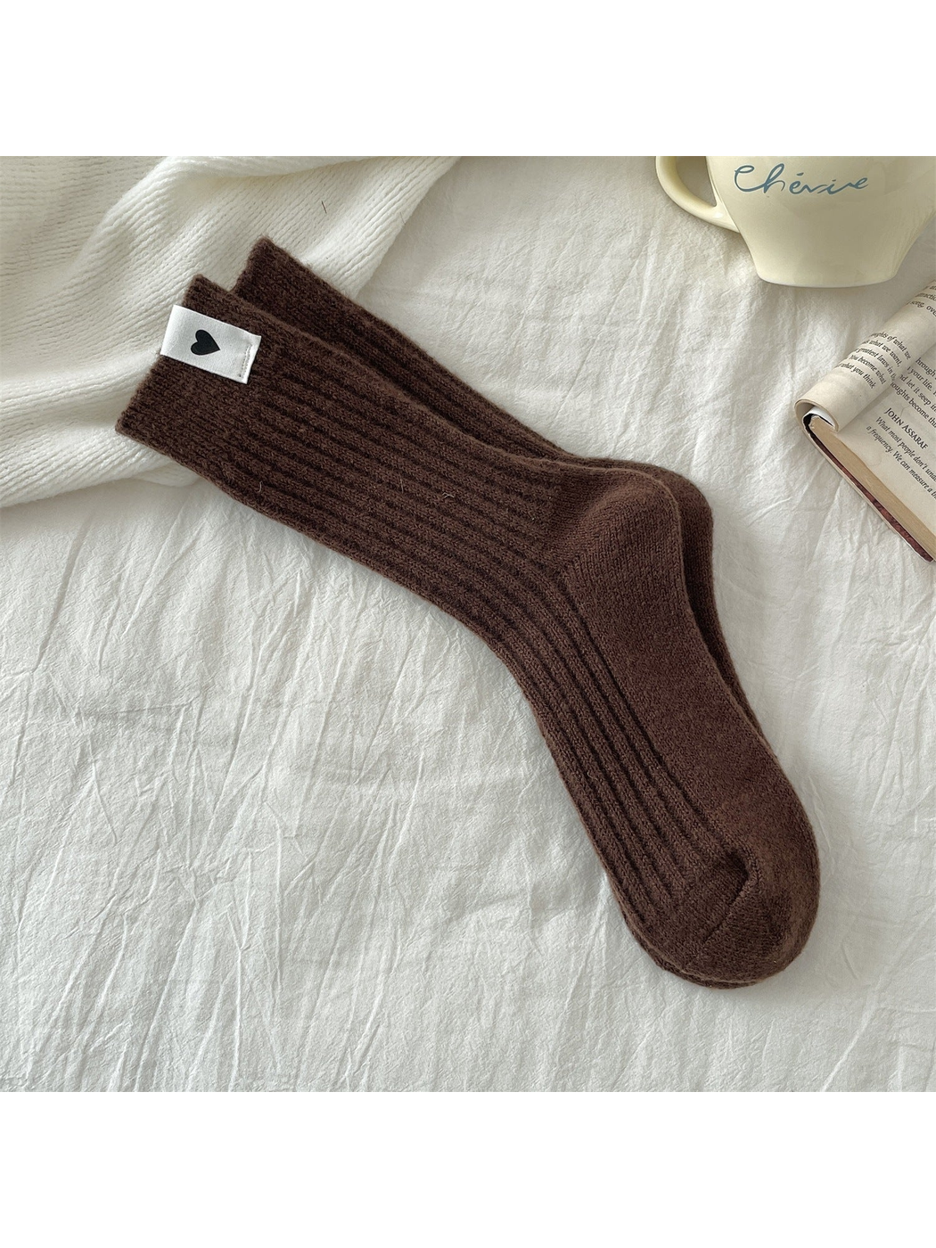 Brown ribbed crew socks with a heart label