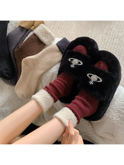 Burgundy contrast-cuff crew socks styled with black slippers beside the other colors