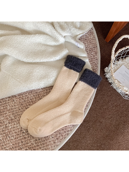 Cream ribbed crew socks with dark gray fuzzy fold-over cuffs