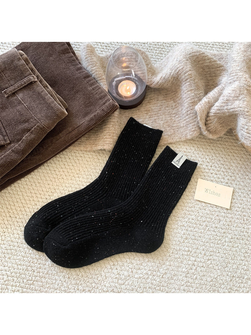 Black ribbed crew socks with multicolor speckles, pair view