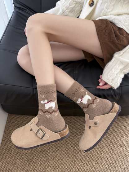 Brown dog-motif fuzzy socks worn as a pair with beige clogs