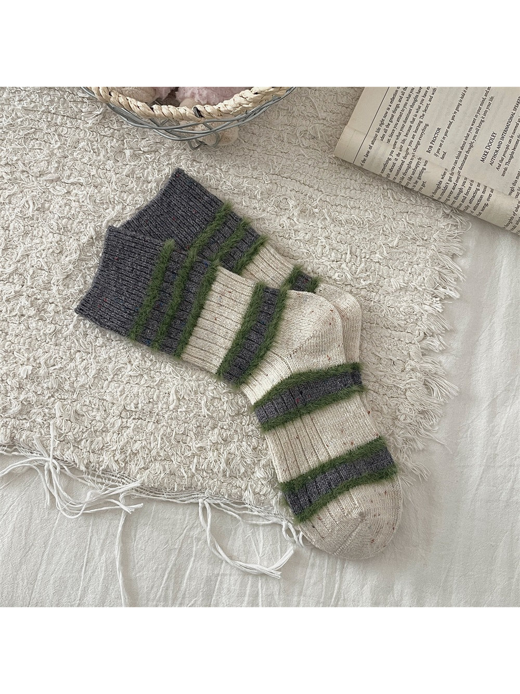 Cream and dark gray crew socks with green fuzzy stripes