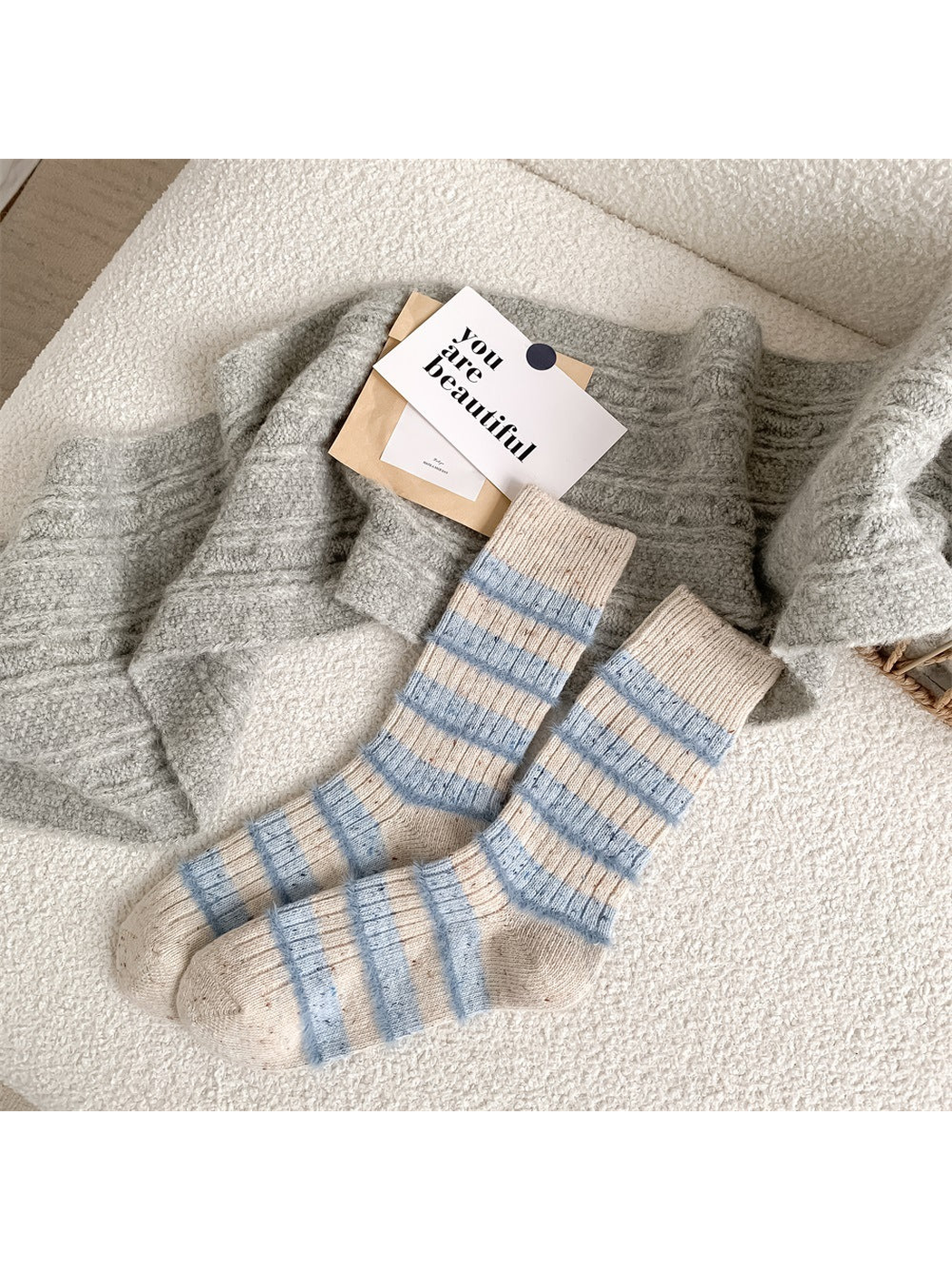 Ivory crew socks with pale blue fuzzy stripes