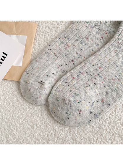 Close-up of rounded sock toes with curved knit seams