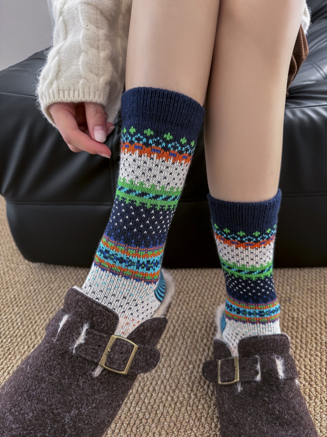 Navy geometric crew socks worn with dark brown clogs