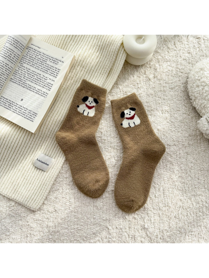 Brown fuzzy socks with white dog motifs