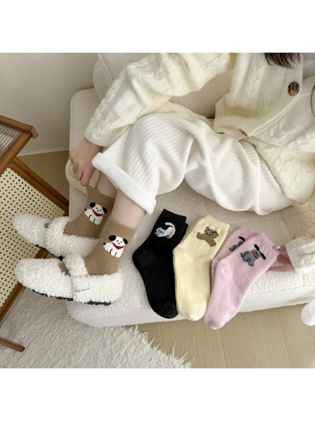Brown white-dog-motif socks worn with the black, pale yellow and light pink styles displayed alongside