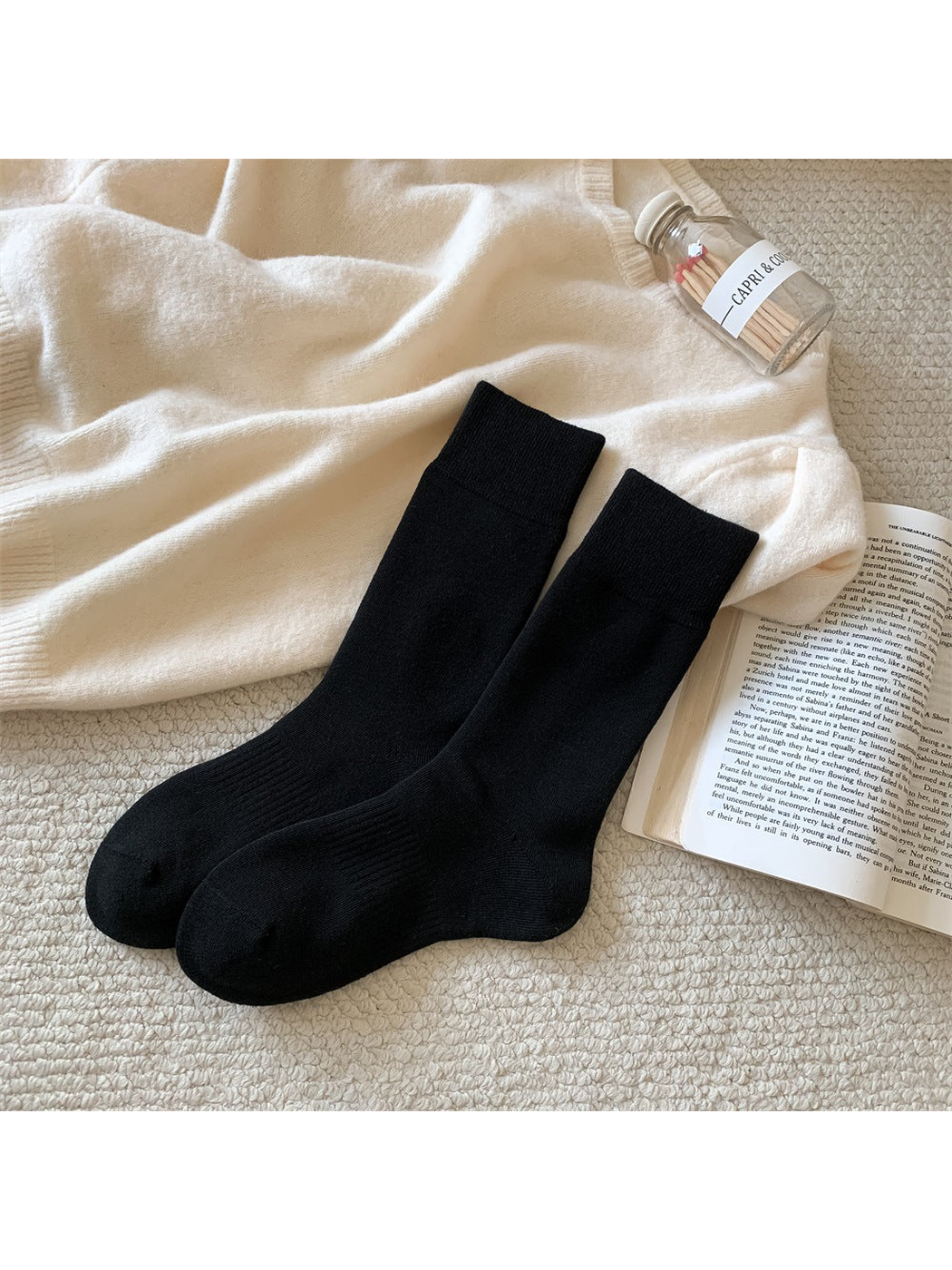Black solid-color crew socks with ribbed cuffs