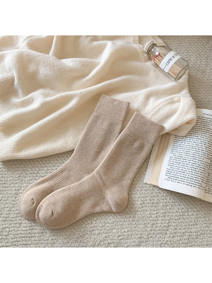 Khaki solid-color crew socks with ribbed cuffs