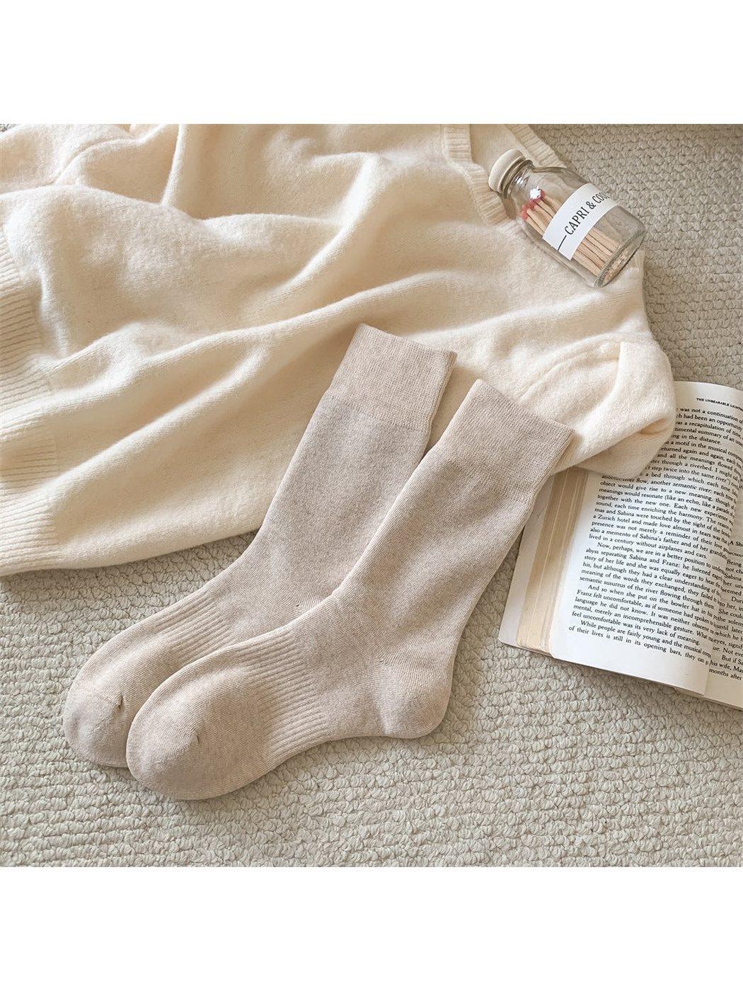 Beige solid-color crew socks with ribbed cuffs