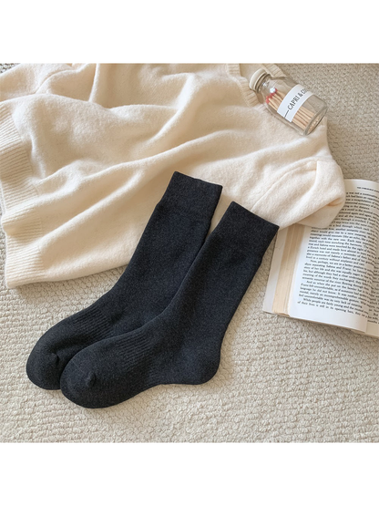 Dark gray solid-color crew socks with ribbed cuffs