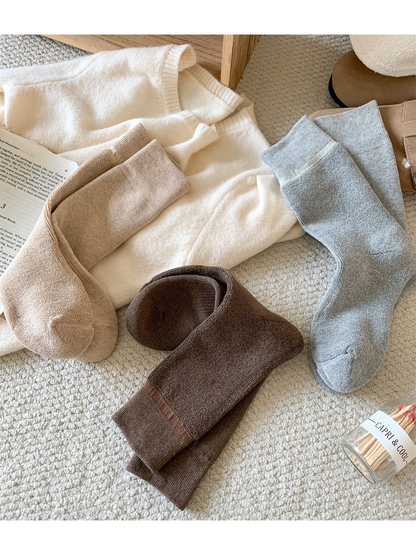 Turned socks showing the looped interior and smooth-knit exterior