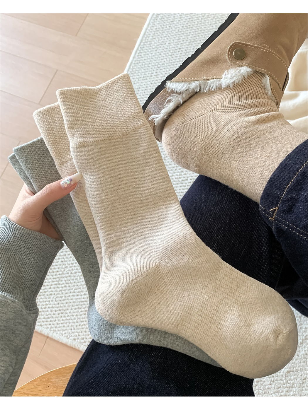 Beige crew sock worn above a lined ankle boot
