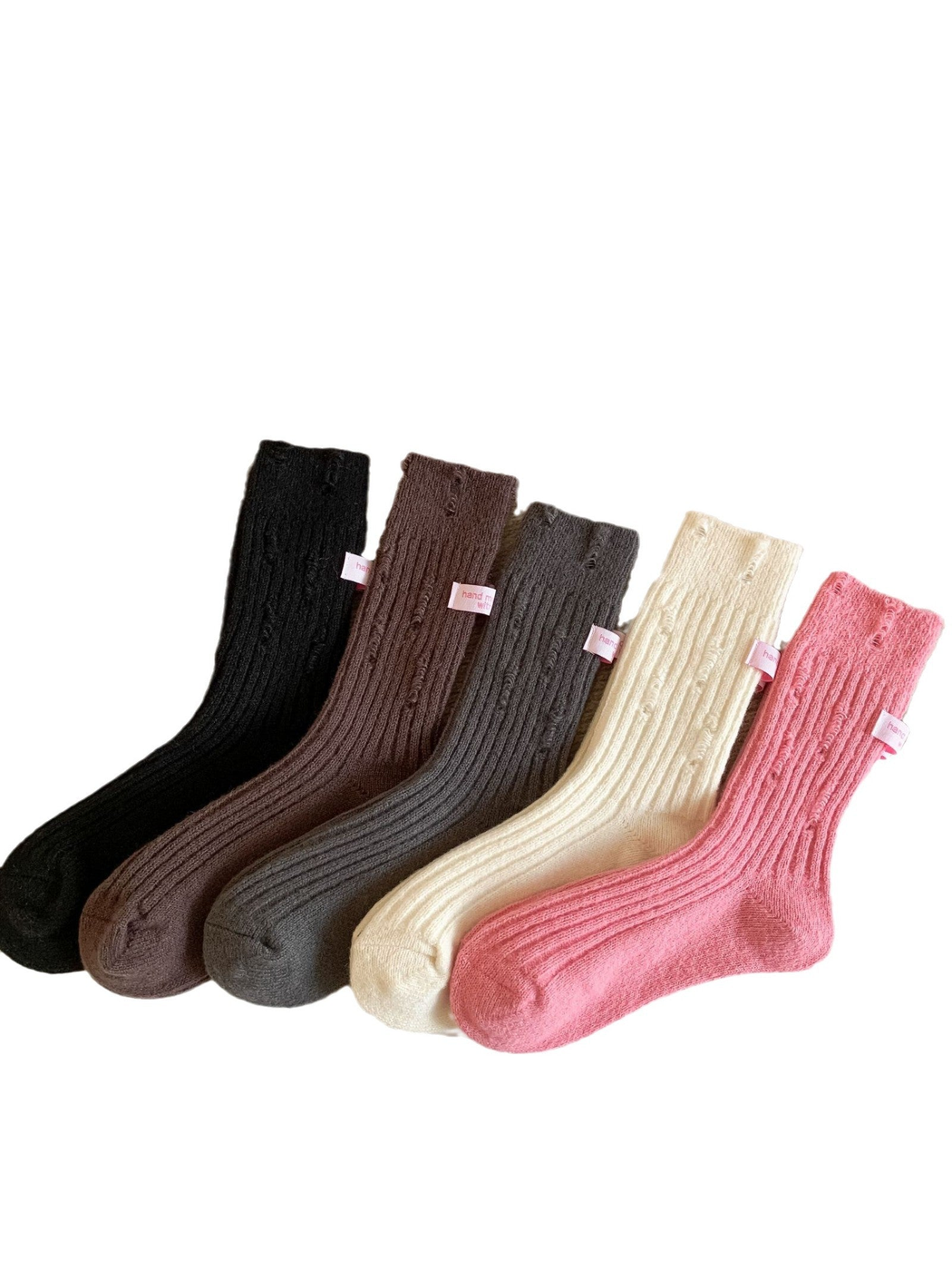 Black, brown, dark gray, cream and pink ribbed crew socks displayed together