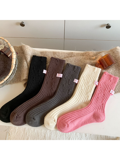 Five colors of ribbed crew socks arranged side by side
