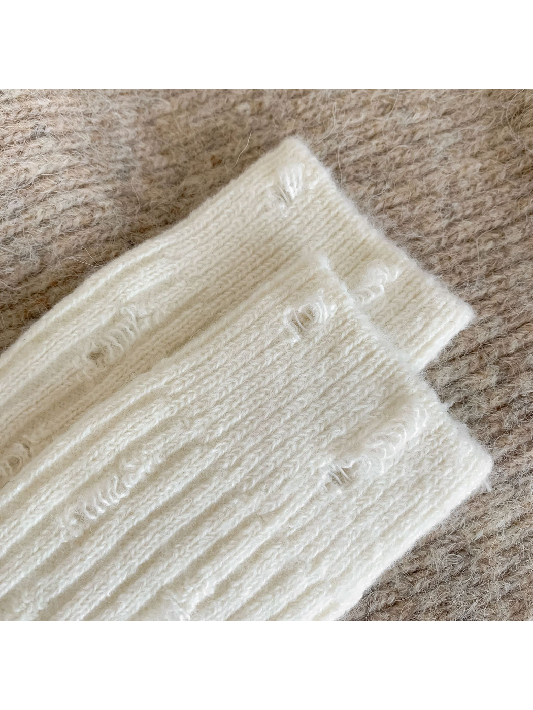 Close-up of cream ribbing and vertical laddered openings