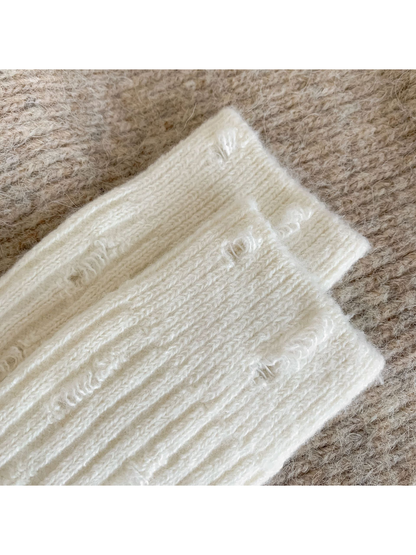 Close-up of cream ribbing and vertical laddered openings