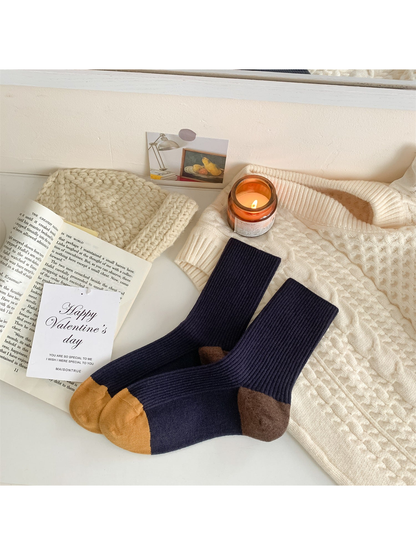 Navy ribbed crew socks with mustard toes and brown heels