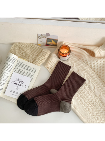 Brown ribbed crew socks with black toes and gray heels